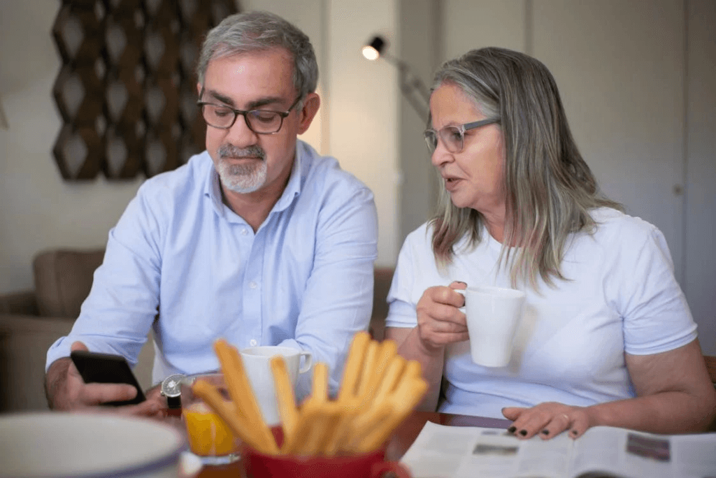 two people looking at a phone