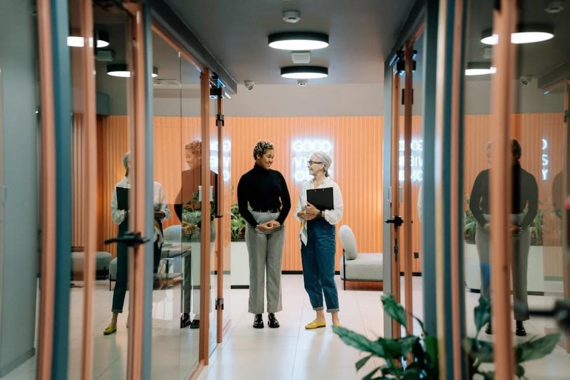 An image of two women in an office in Dallas