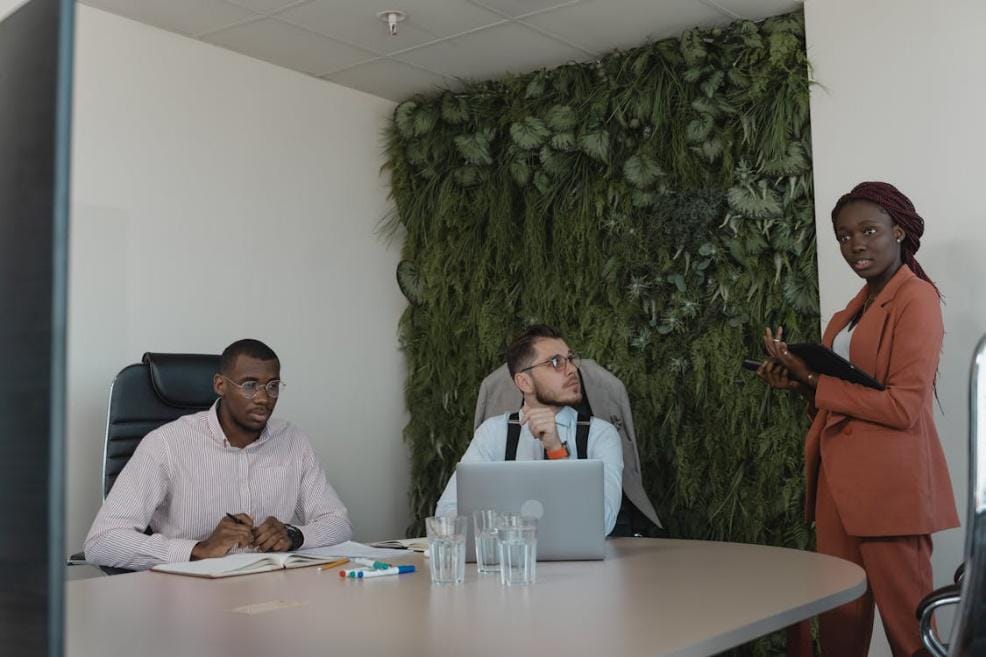 An image of three people in a meeting in an office in Dallas 