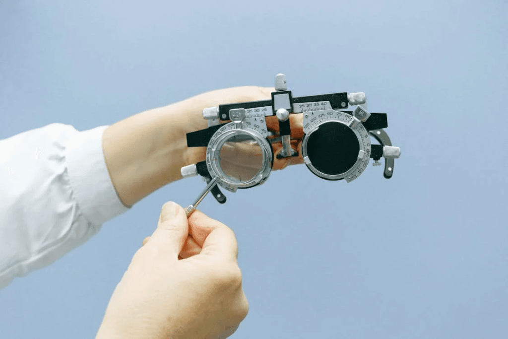 A doctor holding a vision testing device
