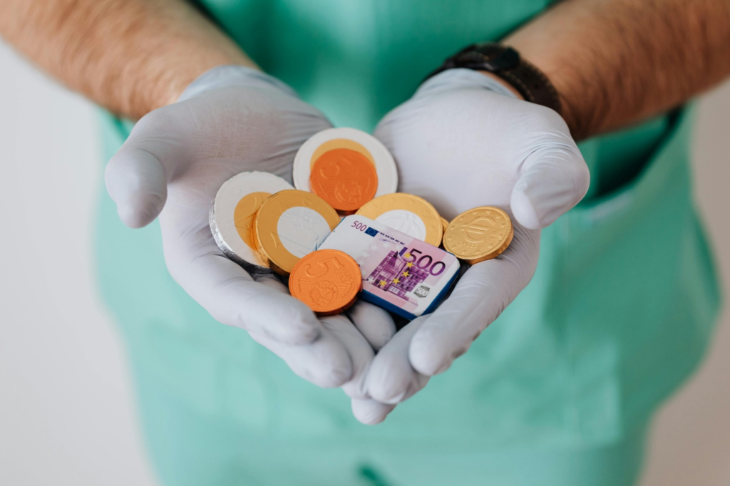 Doctor holding prescription medicines and cash