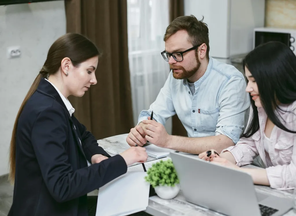 People talking to an insurance agency.