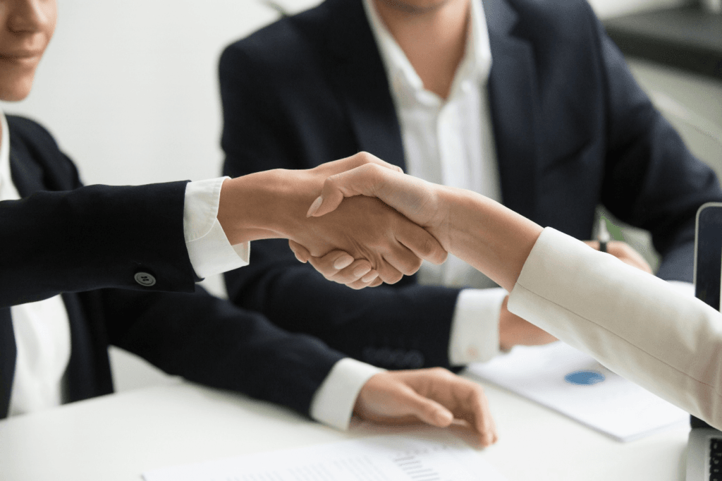 Person shaking hands with insurance agent