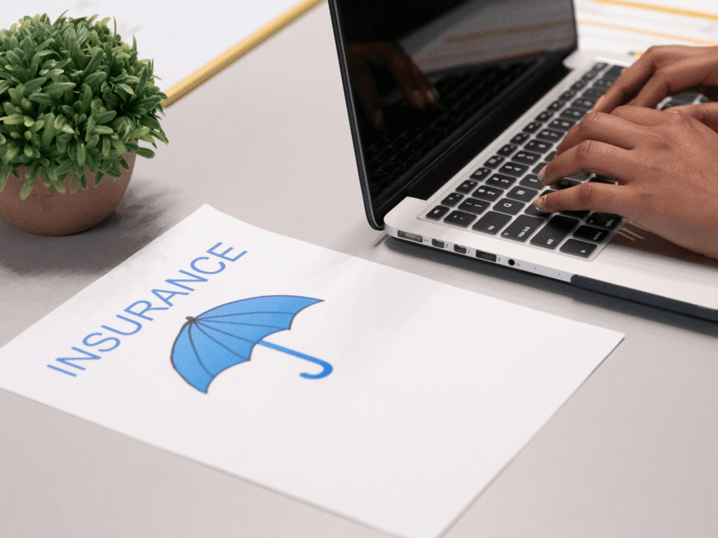 Person looking at insurance plans on a laptop