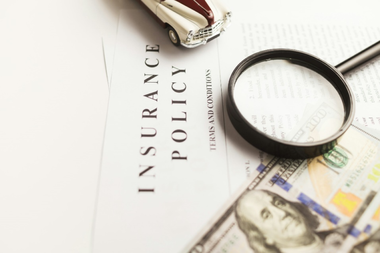 nsurance policy documents on a table showing terms and conditions for clients in Houston