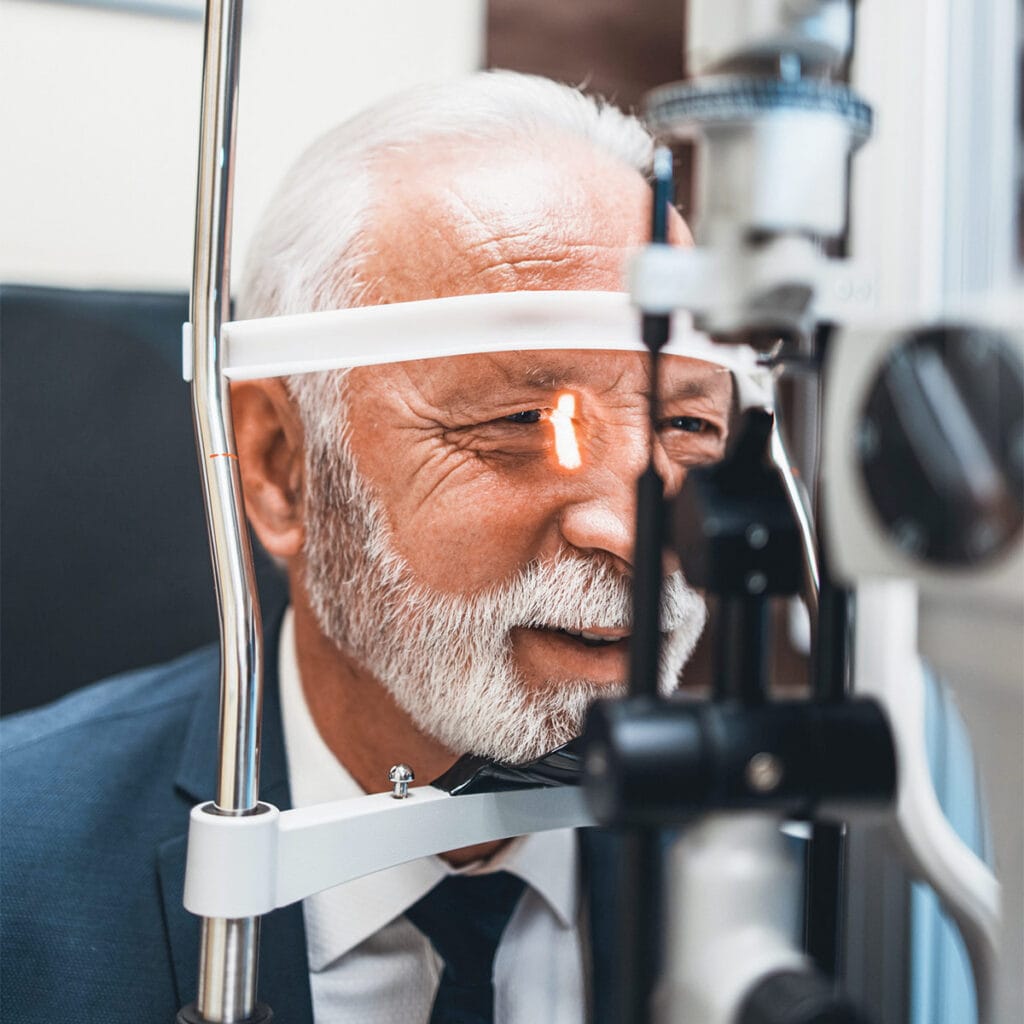 Vision Insurance Plans in Texas image showing a senior during an eye exam.