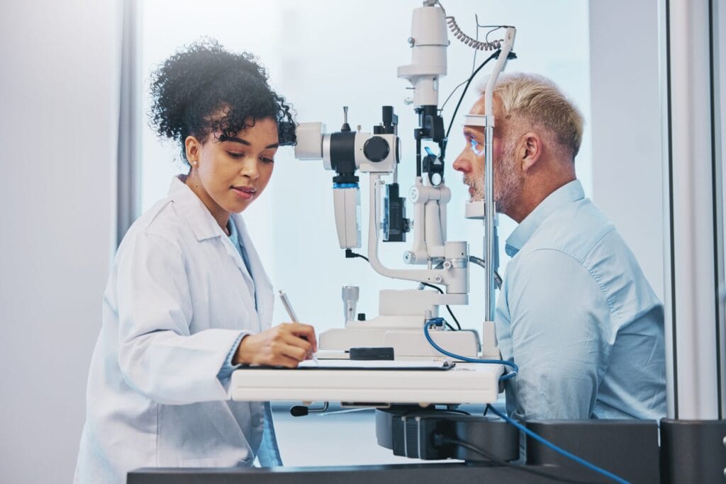 Optometrist examining a patient for Vision Insurance Plans in Texas.