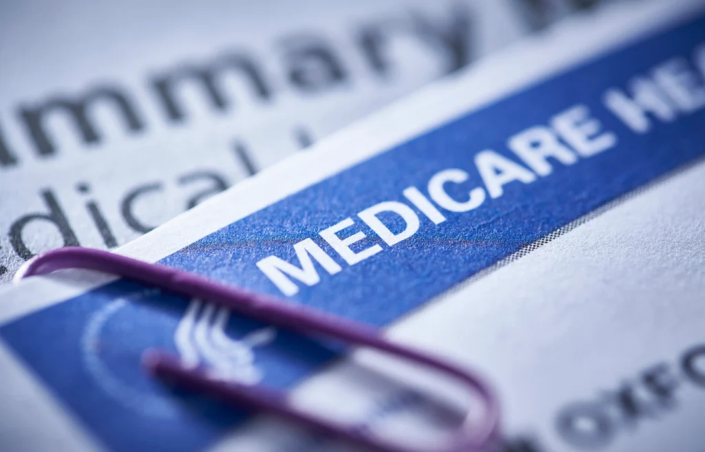 Medicare Supplement Plans in Texas shown with a close-up of a Medicare card and documents.