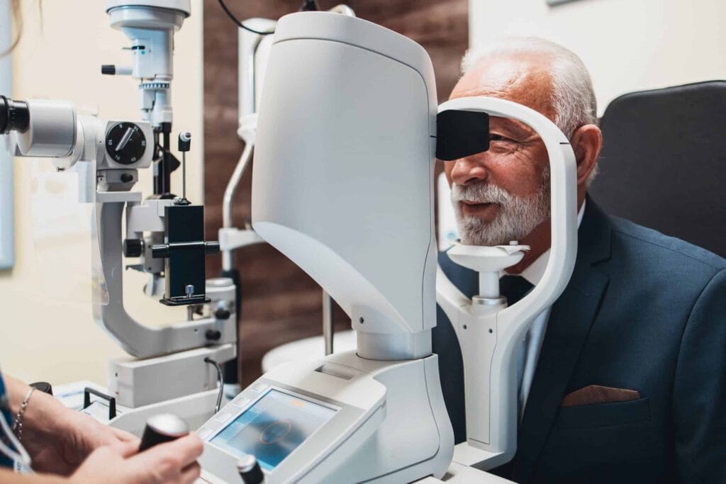 Older adult receiving an eye exam for Vision Insurance Plans in Texas.